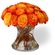 Flame. A bright and vivid arrangement bouquet of fiery orange roses in a vase will tell the recipient about burning feeling of passion...